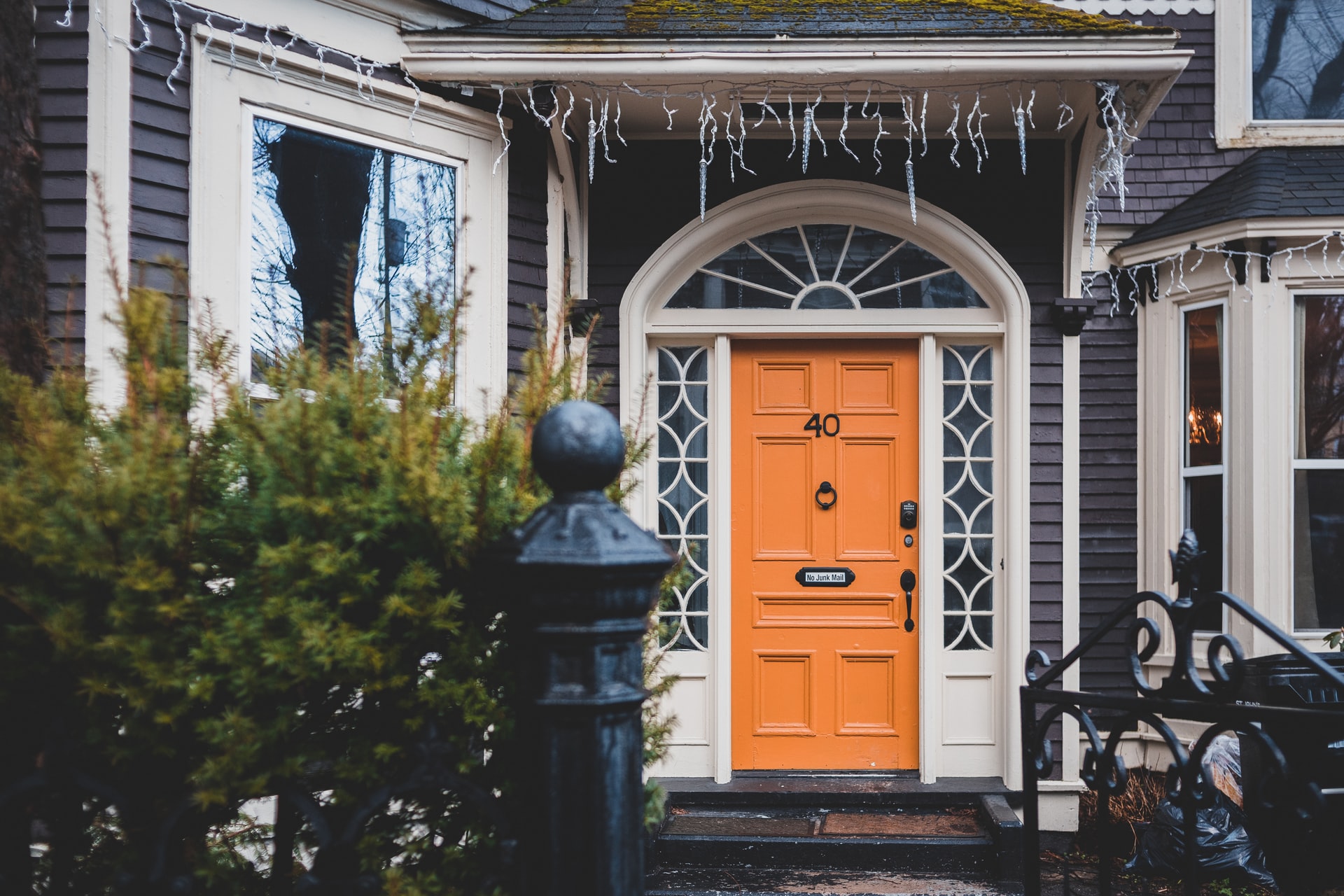 brown door on a blue house